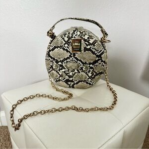 Snake skin print round crossbody tan bag
